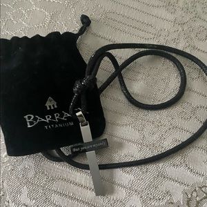 Barraca silver reversible cross necklace.